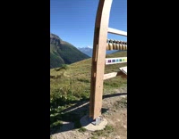 View of mountains melting snow grass houses 