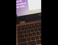 Puppy presses laptop keyboard while girl studies 