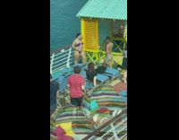 Woman purple bikini pose beside railings ship