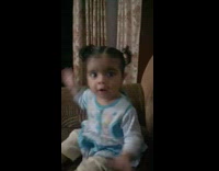 Baby girl dance instead clap brown couch