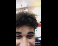 Girl pours chocolate milkshake on guys face 