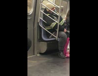 Guy sleeps on train wearing color changing mask 