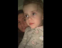 Baby girl picks ear and then gives her finger a taste 
