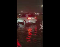 Uber driver drives passengers through flood 