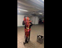 Man kisses and dances skeleton at subway