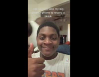 Guy thumbs up brother comes from behind