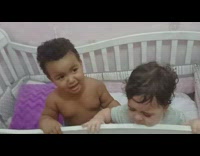 Two babies cry on the crib and gets slapped on the head