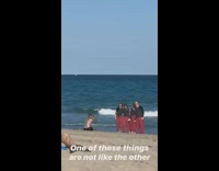 Family red pajama pants jumps beach picture