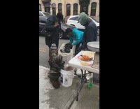 Fish market sidewalk blue jacket white table 