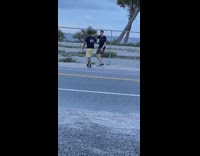 Guy black shirt sing hand movements fence