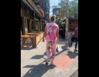 Man pink panther outfit walk on street