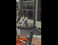 Girl stretching white elastic band at gym 