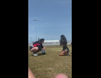 Woman kneels on the ground at the festival concert