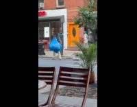 Man carry blue plastic bags drag AC
