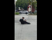 Photographer laying on floor two women balloons street