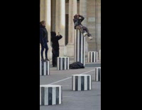 Guy black sweater sit over striped pillar