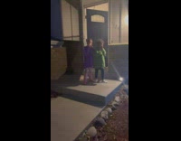 Little kids surprised by snowman decoration 