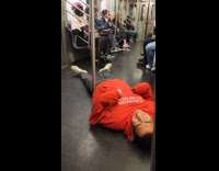 Weird guy lies down on subway floor