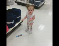 Little girl drops m&m candy on floor picks it up cusses