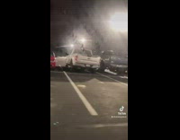 Guy records a jeep parked on hill of snow
