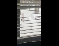 Friend pushes guy on snow pile 