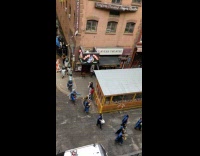 Marching band plays music on street