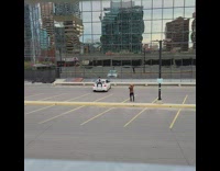 Guy sit behind white car lean spoiler