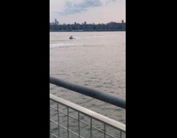 Two guys ride jet ski at river part 2