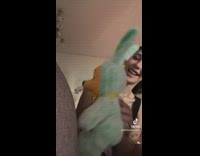 Woman records tiktok with winnie the poo bunny outfit plush