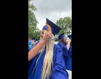 Woman fails to put tassel over cap