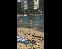 Woman umbrella hat and floatie dance beach
