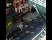 Person Walks on Sidewalk in Reaper Costume 