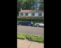 Green car crashes into black jeep parade  