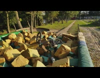 Guy rides bicycle jumps spins foam pit 
