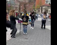 Guy in Lion Costume Dances with People to Live Music 