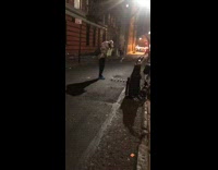 Guy plays golf in dark alley 