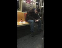 man whipping nose tissues on subway seat