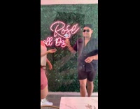 Man and Woman shares a cotton candy on top of a glass