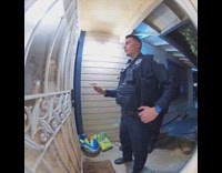 Police forcing their way inside womans home