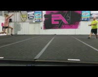 Girl does gymnastic move on platform and lands on head