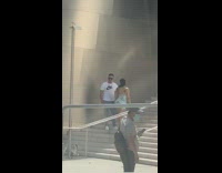 Couple Poses on Stairs at Concert Hall 