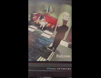 Woman in white outfit sits on the hotel lobby couch