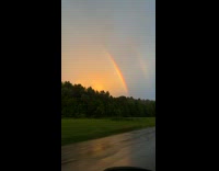 Lightning Strikes in Sky Between Two Rainbows Part 1