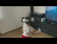 Young girl play beat saber VR TV