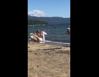 Pink bathing suit girl unicorn float beach 