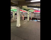 girl pink outfit shaking head subway