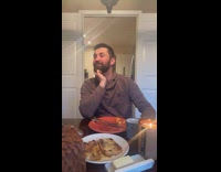 Family pretends to dine  and dog as waiter 