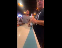 Woman does trend english or spanish with customers 