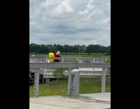 Two girls guy dance yellow shirt dock 