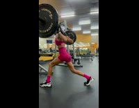 Woman working out drops barbell on neck